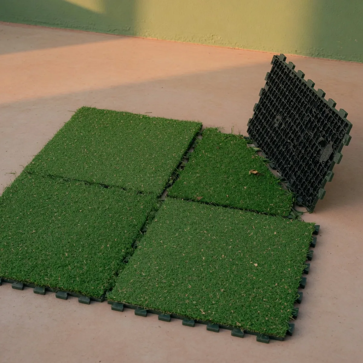 Modular synthetic turf panels with a honeycombed backing designed for indoor putting practice.