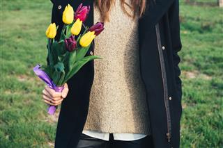 Young Slim Woman With Tulips