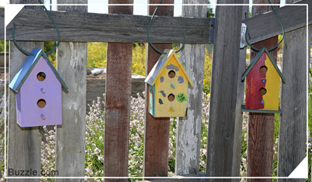 Fence decorated with birdhouses