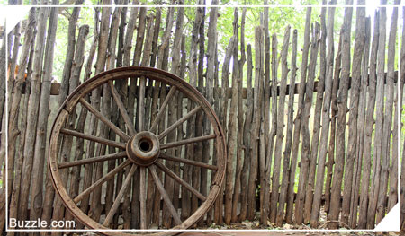 Wheel and log antique fence