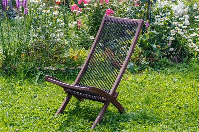 Wooden Chair On A Green Lawn